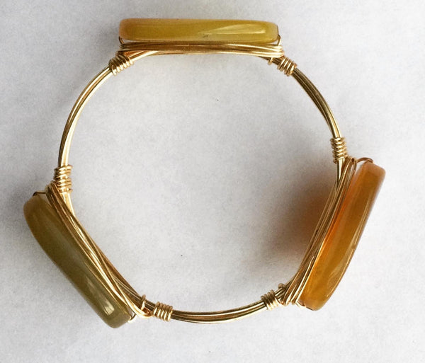 the BOBBY Bangle with Amber Fire Agate Stone