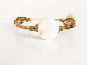 the BOBBY Bangle with White Shell Coin
